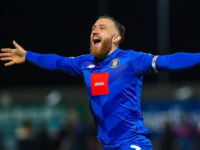 George Thomson celebrates after firing Harrogate Town into a 2-1 lead away at Morecambe. Pictures: Matt Kirkham