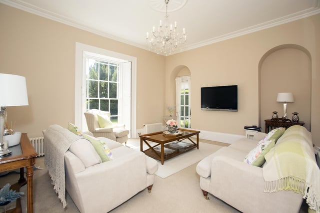 A spacious reception room with the Georgian style windows that feature throughout the house.