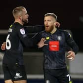 George Thomson, right, is congratulated by Harrogate Town team-mate Alex Pattison after netting his side's 73rd-minute equaliser during Sunday's 3-3 draw at Hartlepool United. Pictures: Matt Kirkham
