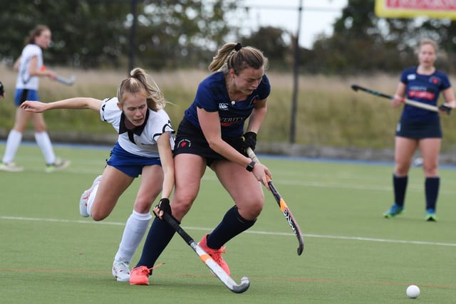 Charlotte Crossman on the attack for the home side.