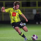 Finn O'Boyle fires home Harrogate Town's first-half equaliser during Tuesday night's EFL Trophy clash with Morecambe. Pictures: Matt Kirkham