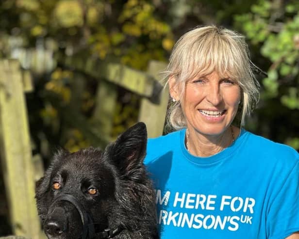 Claire Styles, 60, from Darley near Pateley Bridge who aims to complete the 2,24 miles challenge in time for Christmas is pictured her with her beloved  German Shepherd dog, Luna. (Picture contributed).