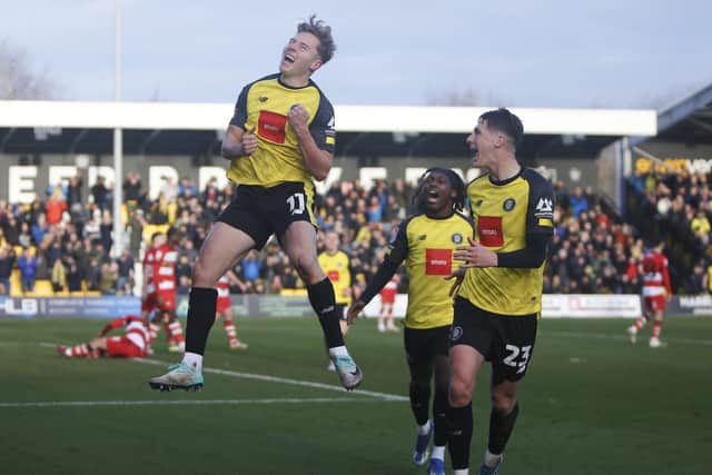James Daly jumps for joy after putting Harrogate Town 2-1 up against Doncaster Rovers. Pictures: Paul Thompson/ProSportsImages