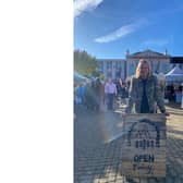 Pictured: Found Jackie Crozier proudly poses with the Little Birds Market sign, at Ripon Market Square.