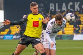 Jack Muldoon, Harrogate Town's lone striker, competes for possession during Saturday's 2-1 home defeat to Crawley. Pictures: Matt Kirkham