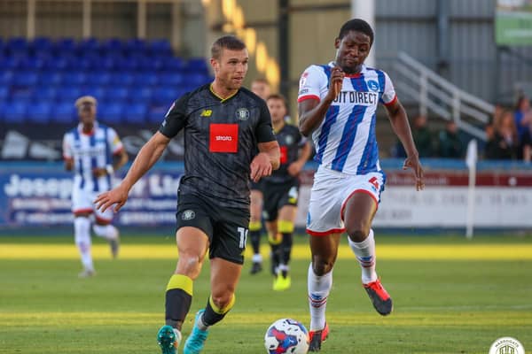 Harrogate Town striker Jack Muldoon is keen to see an improvement from Town when they face Sutton at the weekend.