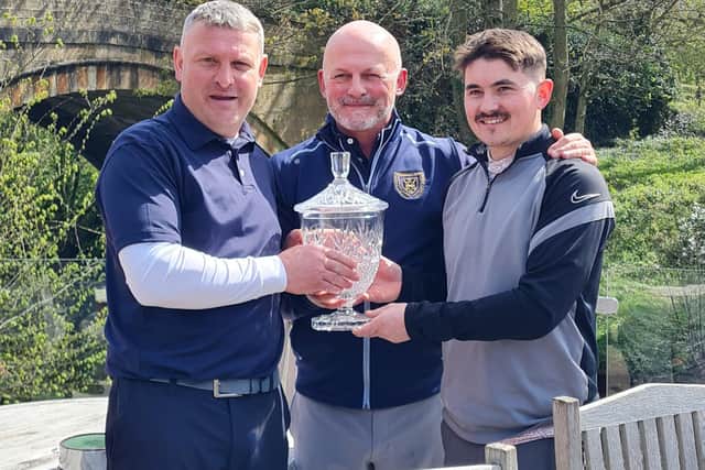 H&D Union president Phil Kitching, centre, presenting the Bill Dobson Trophy to Tom Rodney and Toby Carter at Masham GC. Picture: Submitted