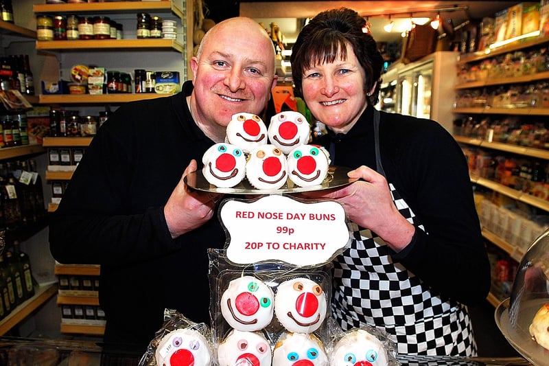 Elliot and Joanne Watkinson from Elliot's Deli in Pateley Bridge selling colourful Red Nose Day buns to raise money for Comic Relief in 2009
