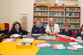 A handy guide to problems - Harrogate pupils Emily and Milo, Harrogate Rotary Club president Ann Percival and pupils Theo and Hattie.