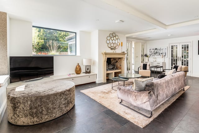 A ground floor reception room with feature fireplace.