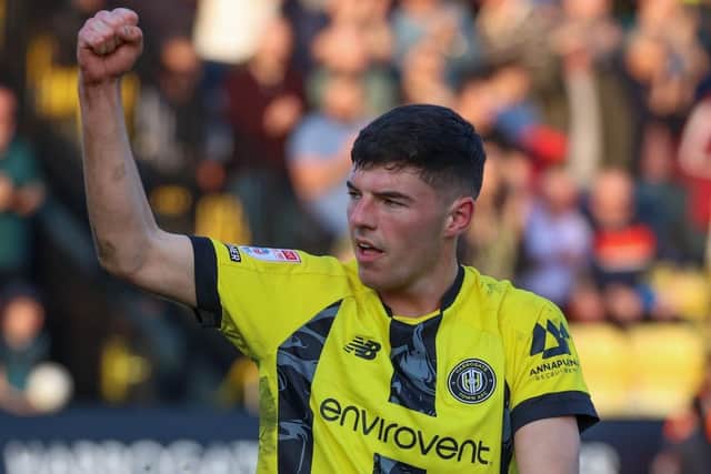 Ellis Taylor celebrates after helping Harrogate Town to a dramatic late victory over Carlisle United.