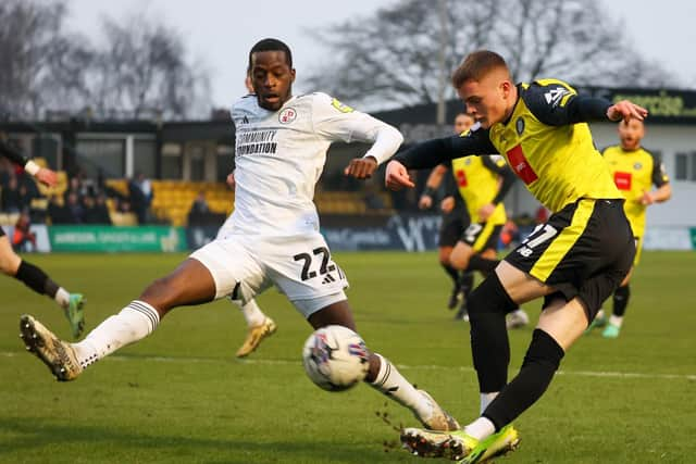 Harrogate Town forward Tom Bloxham looks for a route to goal during the dying minutes of Saturday's game.