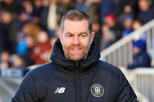 Sulphurites boss Simon Weaver was all smiles for the majority of the first half of New Year's Day's League Two clash at Victoria Park.
