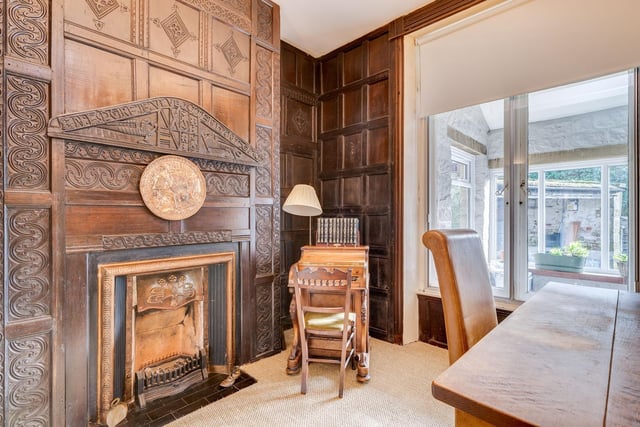 Panelled walls and a feature fireplace add character and charm.