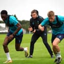 Harrogate Town new boys Shawn McCoulsky, left, and Lewis Cass are put through their paces by fitness coach Ben Rome. Pictures: Harrogate Town AFC