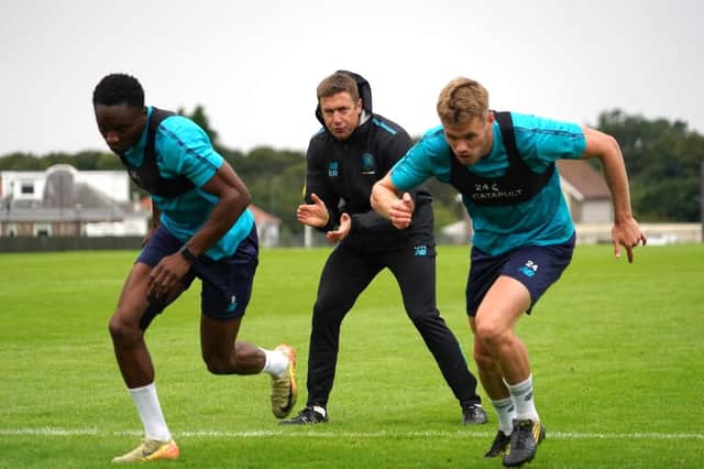 Harrogate Town new boys Shawn McCoulsky, left, and Lewis Cass are put through their paces by fitness coach Ben Rome. Pictures: Harrogate Town AFC