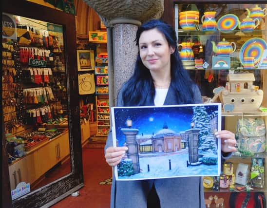 One of Harrogate's emerging artists on the scene, Eve Melia with her painting called "Christmas Eve" outside Harrogate Fair Trade Shop.