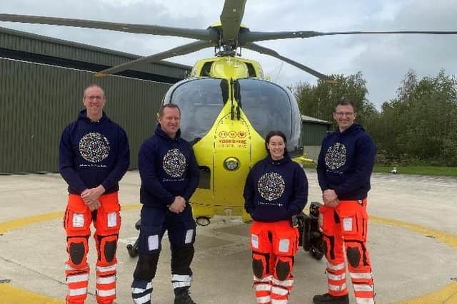 The YAA crew, pictured at the charity's air base in Wakefield, were deeply moved by the thought behind each illustration on the hoodie.