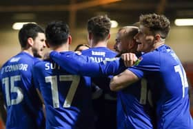 Harrogate Town's players celebrate taking a 2-0 lead during Tuesday night's League Two clash with Doncaster Rovers. Pictures: Matt Kirkham