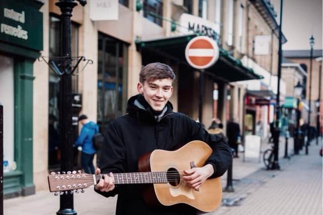 Flashback - As a teenager,  the successful born-and-bred Harrogate musician Will Hanco was often seen busking outside Marks & Spencer's store on Cambridge Street. (Picture contributed)