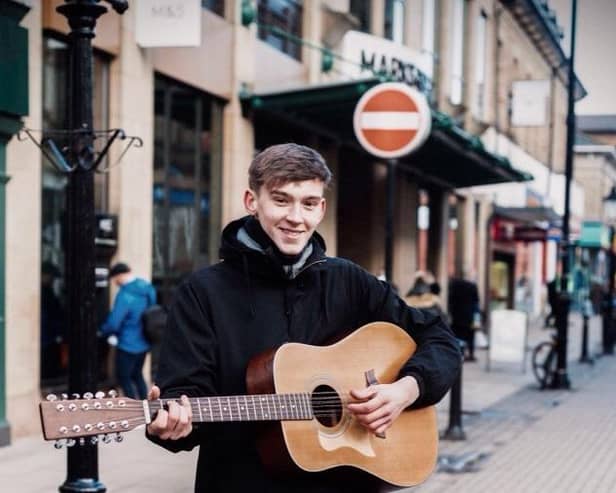 Flashback - As a teenager,  the successful born-and-bred Harrogate musician Will Hanco was often seen busking outside Marks & Spencer's store on Cambridge Street. (Picture contributed)
