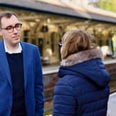 Harrogate and Knaresborough Liberal Democrat spokesperson Tom Gordon talking with a passenger at Knaresborough railway station.