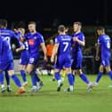 Jack Muldoon takes the congratulations of his Harrogate Town team-mates after opening the scoring during Tuesday night's 2-1 victory at Sutton United. Pictures: Matt Kirkham