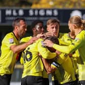 Harrogate Town players celebrate after Alex Pattison fired them into a first-half lead against Hartlepool United. Pictures: Matt Kirkham