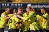 Harrogate Town players celebrate after Alex Pattison fired them into a first-half lead against Hartlepool United. Pictures: Matt Kirkham