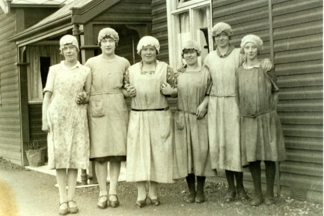 The female staff outside the "B" hostel at Scar village.