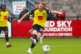 Luke Armstrong fires home the last of his four goals during Harrogate Town's 6-1 success over South Shields. Pictures: Matt Kirkham