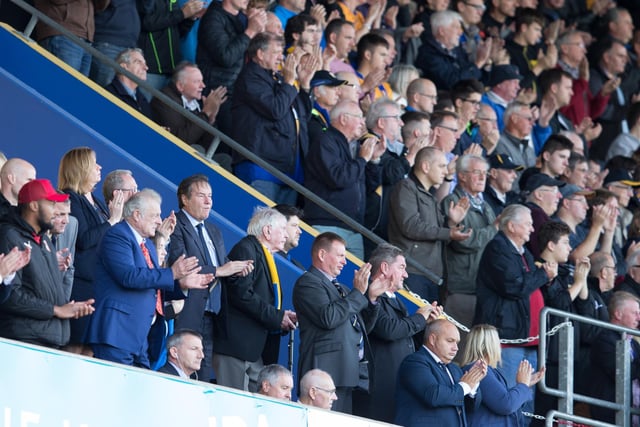 Mansfield Town chairman John Radford joins in a minutes applause for Mansfield Town fan Phil Simms who passed away.