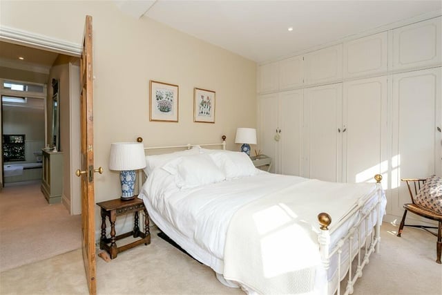 Another of the cottage bedrooms, with built-in wardrobes.
