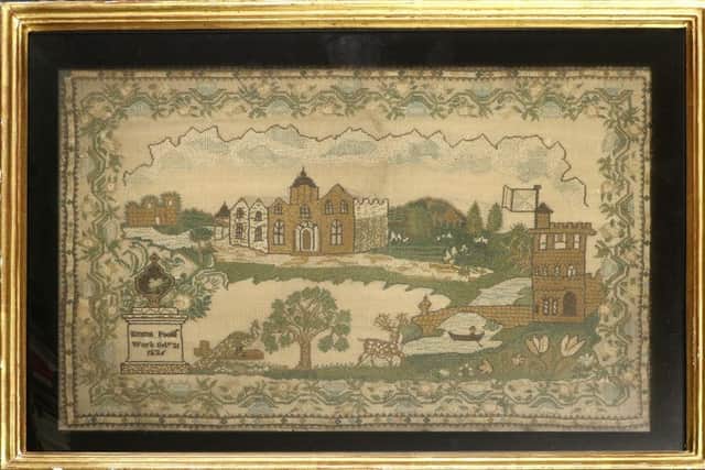 A Needlework Picture, dated 1636, sold for £1,100.