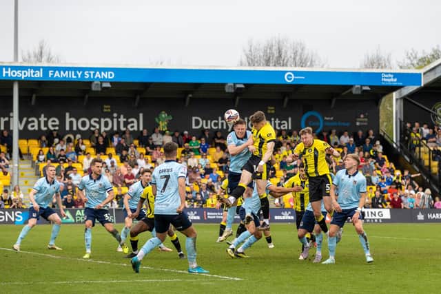 Toby Sims' 87th-minute header from Ellis Taylor's left-wing corner was diverted into his own net by Grimsby's Danny Rose, earning Harrogate Town a 2-2 draw.