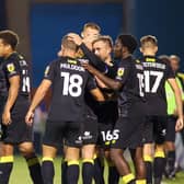 Harrogate Town's players celebrate after taking a 2-0 lead during Tuesday night's League Two clash at Gillingham. Pictures: Matt Kirkham