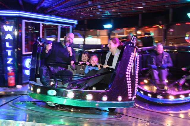 Pictured families enjoy the waltzer ride.