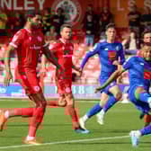 Warren Burrell hooks the ball home from close range to draw Harrogate Town level with Accrington Stanley. Pictures: Matt Kirkham