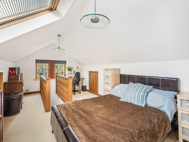 A top floor double bedroom within the property.