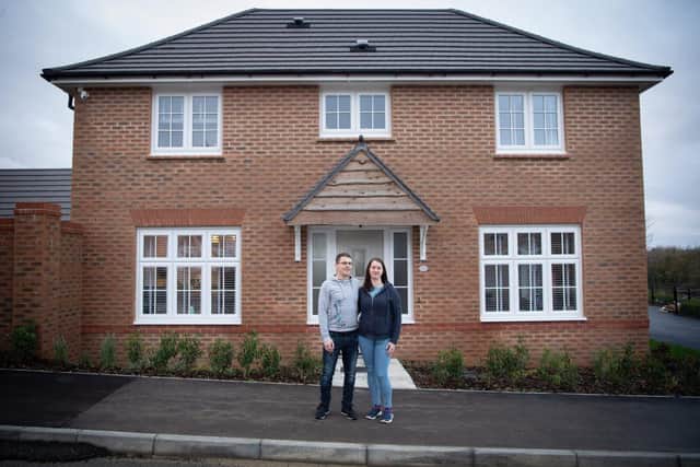 Tom and Cathy outside their new home at Kingsley Manor