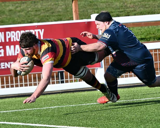 Harrogate RUFC captain Sam Brady dives over the try-line during Good Friday's emphatic victory over Doncaster Phoenix. Picture: Daniel Kerr