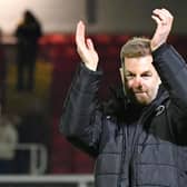 Simon Weaver applauds Harrogate Town's travelling supporters following Tuesday night's 3-2 success at Newport County. Pictures: Harrogate Town AFC