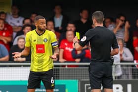 Harrogate Town's Warren Burrell is shown a yellow card during his side's 3-0 win over Swindon Town on the opening day of the 2022/23 season. Picture: Matt Kirkham