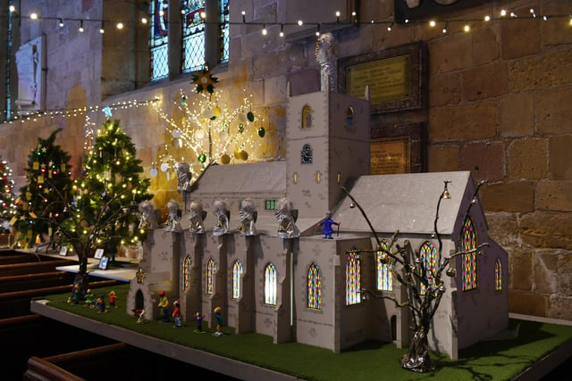 A model of St John’s Parish Church amongst the beautiful Christmas trees
