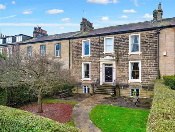 A central pathway and stone steps lead to the front door of the imposing property, currently for sale at £1.8m.