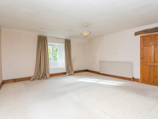 A spacious bedroom within the farm cottage.