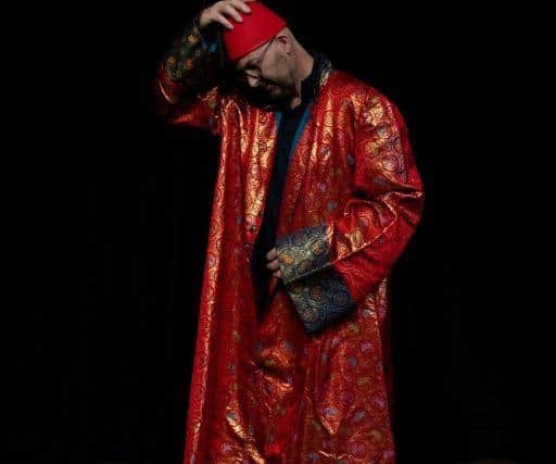 The full length robe worn by the late Tommy Cooper is modelled, prior to be sold this month at auction.
