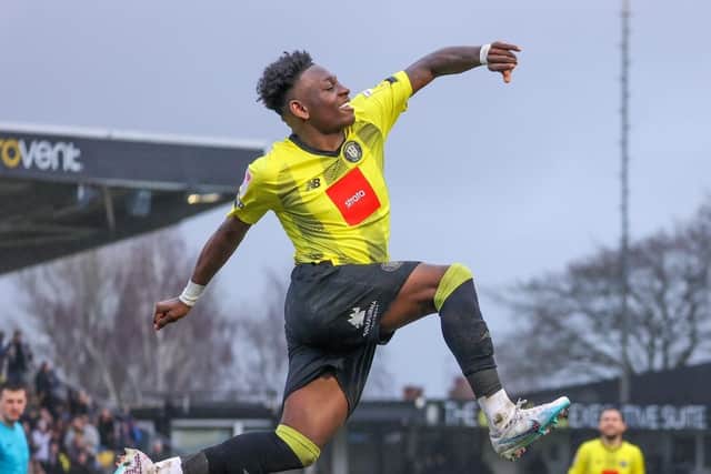 Kazeem Olaigbe celebrates after firing Harrogate Town into a 2-0 lead against Crewe Alexandra.