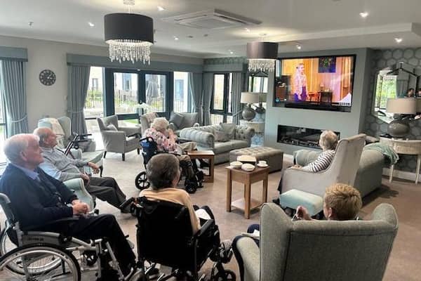 Staff and residents at Highfield care home enjoying a virtual screening of Some Mothers Do 'Ave 'Em