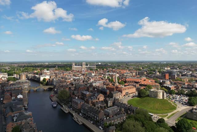 An aerial shot of York. The historic city attracts visitors from across the world to venues such as Clifford’s Tower in the foreground and York Minster.
